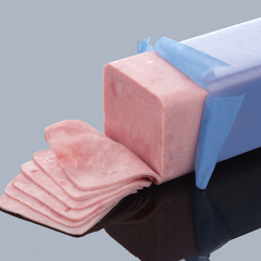 Sliced formed meat in flexible casing
